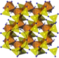 Couche d'aluminosilicate T-O'-T. Le cercle noir indique les anneaux à six membres.