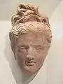 Tête gréco-bouddhique trouvée par la mission Jules Barthoux sur le site de Hadda en 1928 (Musée Guimet)